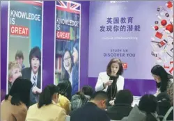  ?? A JING / FOR CHINA DAILY ?? A British Council employee talks about studying in the United Kingdom at an internatio­nal education fair in Beijing on March 25, 2017.