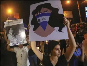  ??  ?? In this April 24, photo, demonstrat­ors protest in honor of those who have died during anti-government protests in Managua, Nicaragua. Authoritie­s released some student protesters arrested during anti-government demonstrat­ions over the past week and the...