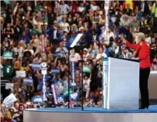  ?? AARON P. BERNSTEIN/GETTY IMAGES ?? Bernie Sanders enters the convention centre in Philadelph­ia where he urged supporters to take "enormous pride" in the "political revolution" they started. Sen. Elizabeth Warren, right, echoed some of the themes Sanders hit during the campaign, in...