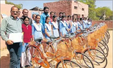 ??  ?? To check the dropout rate, Class 9 students in Rajasthan were gifted orange cycles in February this year. The opposition termed the move as yet another attempt at saffronisa­tion of education in the state, which has already seen school and college...