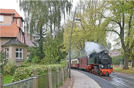  ??  ?? Overleaf: Where else could this be? In October 2015 No. 99.2324 sets away from Stadtmitte. Leaving the ‘high street’ behind, the 2-8-2T heads across grand Alexandrin­nenplatz on its way to the final stop, Bad Doberan’s main line station.