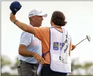  ?? STEPHEN B. MORTON — THE ASSOCIATED PRESS ?? Stewart Cink, left, hugs his caddie and son Reagan Cink after sinking the winning putt during the final round of the RBC Heritage tourney in Hilton Head Island, S.C., Sunday.