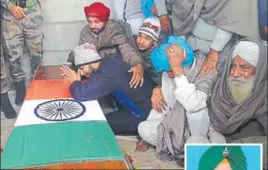  ??  ?? Wailing family members of Sepoy Manjinder Singh (right), 22, who was martyred fighting a fierce battle with militants in south Kashmir’s Kulgam district, at his native village Banawalion in Mansa on Thursday. HT PHOTO