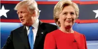  ?? — Reuters ?? Donald Trump and Hillary Clinton take the stage for their first debate at Hofstra University in Hempstead.