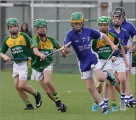  ??  ?? Jack Nolan of Oylegate-Glenbrien is tackled by Ryan Kavanagh (HWH-Bunclody).