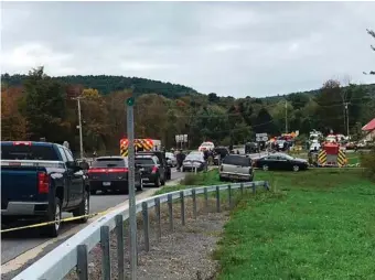  ??  ?? HORROR CRASH: Emergency services personnel respond to the scene of a deadly crash.