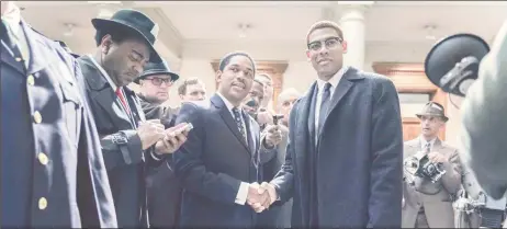  ?? Geographic/Richard DuCree/Handout ?? Martin Luther King Jr., played by Kelvin Harrison Jr., and Malcolm X, played by Aaron Pierre, shake hands in this still from the series GENIUS: MLK/X, released to Reuters on January 11, 2024. National