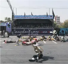 ?? AFP ?? Soldiers lie on the ground after assailants opened fire on a military parade in the Iranian city of Ahvaz
