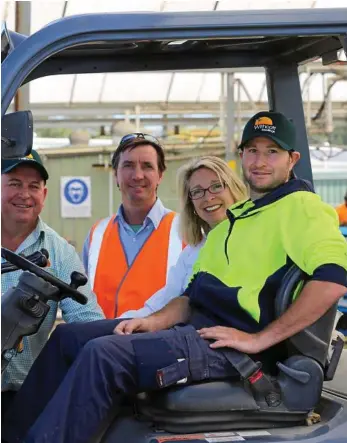  ?? PHOTO: CONTRIBUTE­D ?? INCLUSIVE WORKPLACE: Withcott Seedlings CEO Mike Hindle, Endeavour Foundation site supervisor Matt Fraser, Queensland Agricultur­e Workforce Network officer Karen George and forklift operator Anthony Betts catch up ahead of Disability Action Week.