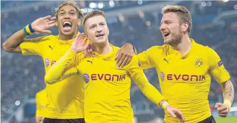  ?? FOTO: DPA ?? Hört, hört! Borussia meldet sich internatio­nal zurück – mit ( v. li.) Pierre- Emerick Aubameyang, Torschütze Marco Reus und Ciro Immobile.