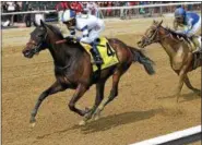  ?? CHELSEA DURAND/NYRA ?? Moonlit Garden with Jose Ortiz aboard races to the wire to capture Sunday’s $100,000Summer Colony at Saratoga Race Course.