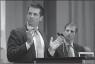  ?? The Associated Press ?? Grand Opening: Donald Trump Jr., left, speaks as his brother Eric looks on during speeches at the grand opening of the Trump Internatio­nal Hotel and Tower in Vancouver, B.C., on Tuesday.