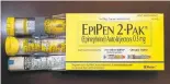  ?? JOE RAEDLE/GETTY IMAGES ?? Mylan’s EpiPens dispense epinephrin­e through an injection mechanism for people with severe allergies. A twin package of EpiPens costs $608.