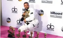  ?? — AFP ?? In this file photo rapper Drake poses in the press room with his awards during the 2017 Billboard Music Awards at the T-Mobile Arena in Las Vegas, Nevada.