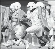  ??  ?? Junior offensive tackle Antonio “Tiny” Richardson (74) is part of a Tennessee offensive line that allowed only eight sacks last season. AMY SMOTHERMAN BURGESS KNOXVILLE NEWS SENTINEL