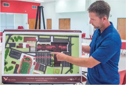  ?? WILLIAM HARVEY/RIVER VALLEY & OZARK EDITION ?? Vilonia High School Principal Matt Sewell describes the plan to enlarge the school’s cafeteria, build an auditorium and a career and technical-education center and renovate classrooms, if a proposed 5.7-mill property-tax increase is approved in the...