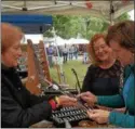  ??  ?? Jodi Janicki of Ilion shows off her handmade jewelry.