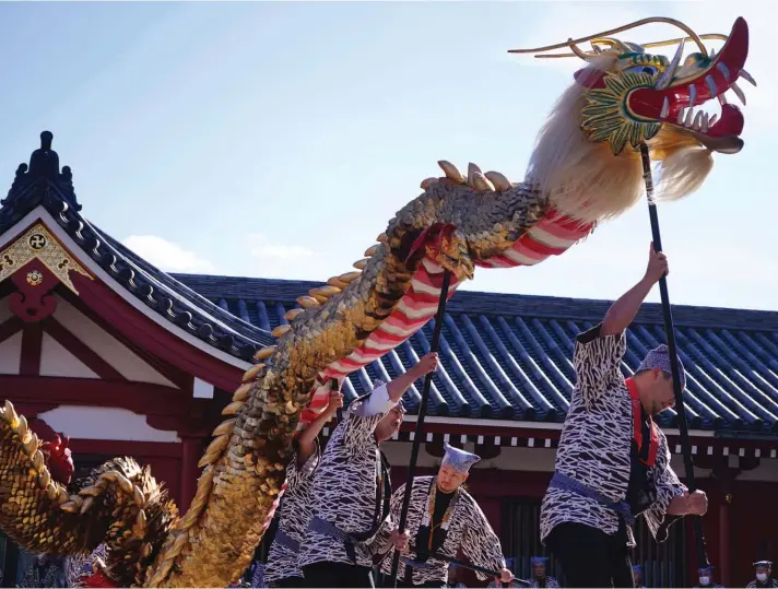  ?? ?? "Kinryu no Mai," or Golden Dragon Dance is performed by locals at Sensoji Temple at Asakusa neighbourh­ood yesterday, in Tokyo. Photo: AP