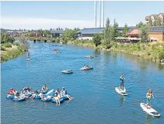  ?? PHOTO BY JILL ROSELL ?? The Deschutes River near Bend, Ore., is a favorite spot for water sports, from tubing to stand-up paddle boarding.