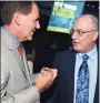  ?? Amanda Gordon / Bloomberg ?? Steven Cohen, chairman and chief executive officer of SAC Captial Advisors LP, right, speaks with Paul Tudor Jones, chief executive officer of Tudor Investment Corp.