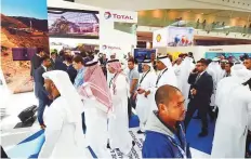  ?? Abdul Rahman/Gulf News ?? Visitors at the Total pavilion in Adipec 2018. The exhibition ■ and conference runs till Thursday.