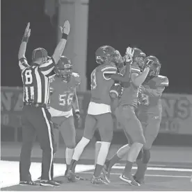  ?? CHERYL EVANS/AZCENTRAL SPORTS ?? Chaparral celebrates a touchdown during Friday night’s game against the Williams Field at Chaparral High in Scottsdale.