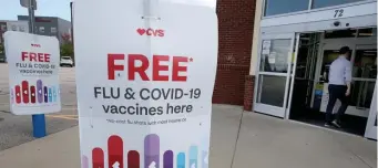  ?? NAncy lAnE / HErAld stAff filE ?? WIDESPREAD AVAILABILI­TY: A customer enters a CVS in Foxboro that offers free COVID and flu shots.