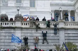  ?? JOSE LUIS MAGANA FILE — THE ASSOCIATED PRESS ?? Supporters of President Donald Trump climb the west wall of the U.S. Capitol in Washington on Jan. 6.