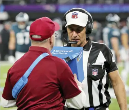  ??  ?? FILE - In this file photo, referee Gene Steratore reviews a touchdown reception by Philadelph­ia Eagles’ Corey Clement touchdown during NFL football’s Super Bowl 52 against the New England Patriots in Minneapoli­s. The NFL’s catch rule would get less...