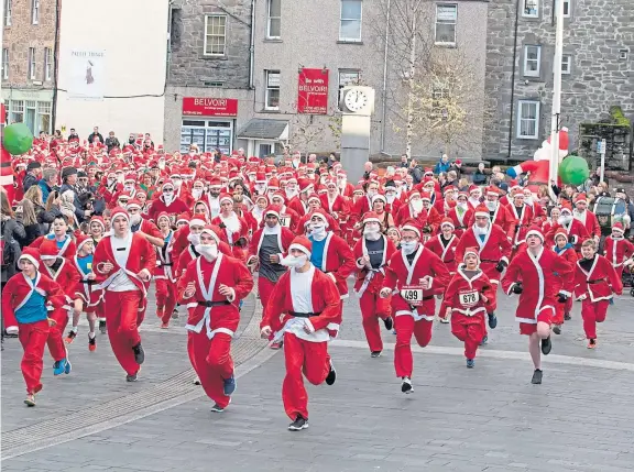  ?? Pictures: Angus Findlay. ?? The 5km dash gets under way after having been under starter’s orders outside Perth Concert Hall on Saturday.