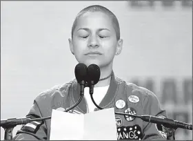  ?? AP/ALEX BRANDON ?? Emma Gonzalez, a student at Marjory Stoneman Douglas High School, leads the crowd Saturday in Washington in a tearful silence after reciting the names of those killed at her school.