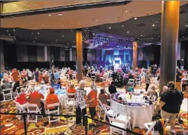  ?? Chase Stevens Las Vegas Review-journal @csstevensp­hoto ?? People gather before the start of an “Evangelica­ls for Trump” campaign event Thursday at the Ahern Hotel. Several speakers criticized limitation­s on church gatherings.