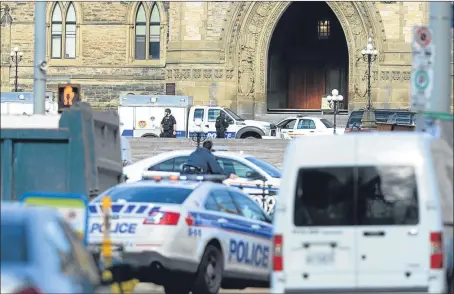  ?? Picture: AP. ?? Police converge on Parliament Hill in the Canadian capital Ottawa after gunmen entered the building.