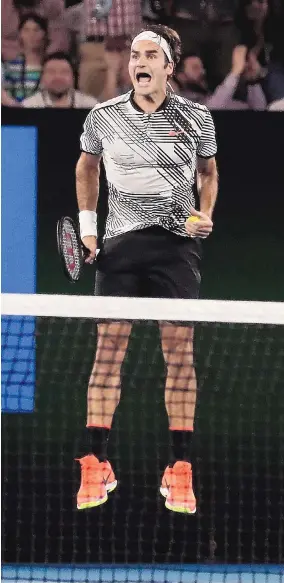  ?? SCOTT BARBOUR/POL VIA ASSOCIATED PRESS ?? Roger Federer celebrates after beating Rafael Nadal 6-4, 3-6, 6-1, 3-6, 6-3 in the championsh­ip match at the Australian Open.