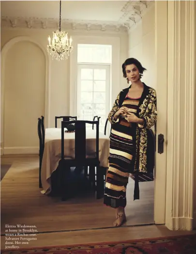  ??  ?? Elettra Wiedemann, at home in Brooklyn, wears a Rochas coat. Salvatore Ferragamo dress. Her own jewellery.