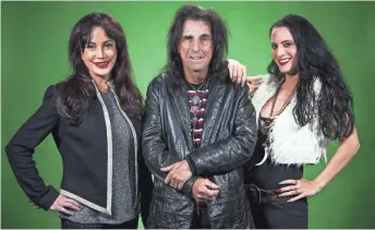  ??  ?? Alice Cooper’s daughter Calico, right, played the same role on tour as his wife, Sheryl, left.