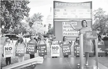  ??  ?? House Minority Leader Nancy Pelosi speaks to the crowd during a protest against the GOP health care plan, on Capitol Hill in Washington, DC. — AFP photo