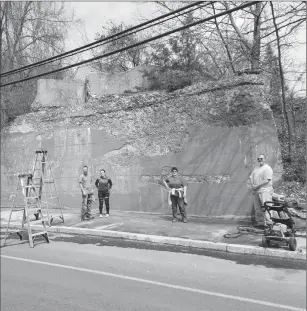  ?? Joseph B. Nadeau photo ?? Prep work continues at the Grand Trunk Railroad abutment along Cass Avenue. The concrete slab, approximat­ely 60 feet long and 14 feet high, will eventually be a colorful mural.