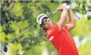  ?? AFP ?? Rattanon Wannasrich­an plays a shot during the 2018 Myanmar Open.