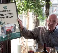  ??  ?? In his youth, Roebuck looked up to both Moss and Clark. Here he displays a poster from Clark’s first F1 win, the 1962 Belgian GP