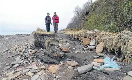  ?? Picture: Rick Booth. ?? Walkers encounter Fife Coastal Path erosion at West Wemyss.