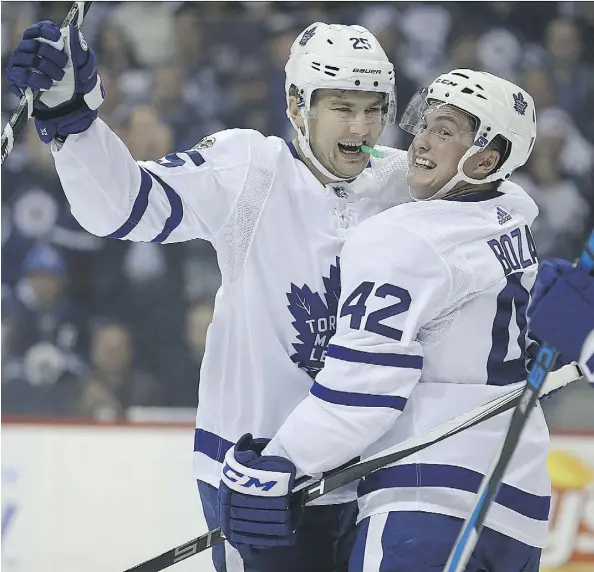  ?? KEVIN KING ?? James van Riemsdyk celebrates his goal with Maple Leafs teammate Tyler Bozak en route to dismantlin­g the Jets in Winnipeg, Wednesday.