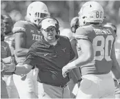  ?? Tom Reel / San Antonio Express-News ?? Texas coach Tom Herman hopes to use today’s Texas Bowl as a springboar­d for his program to next season and beyond.