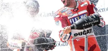  ?? JURE MAKOVEC/AFP PHOTO ?? LUAR BIASA: Pembalap Ducati Andrea Dovizioso merayakan kemenangan ketiganya tahun ini pada MotoGP Austria di Red Bull Ring, Spielberg, kemarin. Dia menang setelah bertarung hingga tikungan terakhir melawan Marc Marquez.