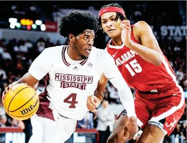  ?? ?? Mississipp­i State’s Cameron Matthews (4) drives against Alabama’s Noah Clowney (15) during the earlier meeting this season in Starkville. (Photo by Mike Mattina, MSU Athletics, for Daily Times Leader)