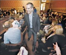  ?? Charlie Neibergall Associated Press ?? LOS ANGELES MAYOR Eric Garcetti arrives at a meeting with the Asian and Latino Coalition political action committee in Des Moines in April.