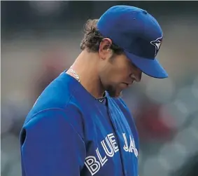  ?? LEON HALIP/Getty Images file photo ?? Plagued by elbow problems, Josh Johnson had a terrible 2013 season with the Toronto Blue Jays. He’s hoping for a rebound after signing a one-year contract with San Diego.