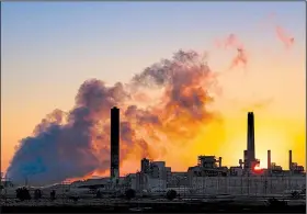  ?? AP/J. DAVID AKE ?? The Dave Johnson coal-fired power plant in Glenrock, Wyo., churns in the morning sun in late July. The Environmen­tal Protection Agency on Tuesday proposed easing carbon dioxide limits on such plants by giving states latitude in setting emission standards.