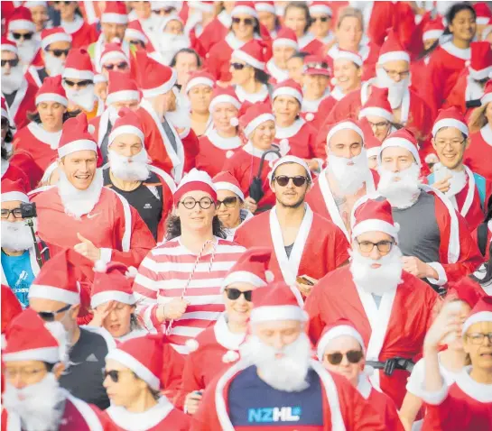  ?? Photo / Michael Craig ?? The annual Santa Run hrough Wynyard Quarter, Auckland, on Wednesday.