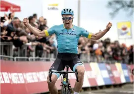  ??  ?? Astana's Valgren celebrates after winning the sprint to the line in Amstel